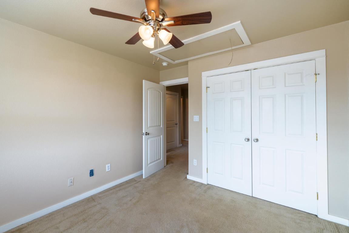 2102 Laura Court Round Rock, TX 78681 - Photo 18 of 32 an empty room with a ceiling fan and a fan