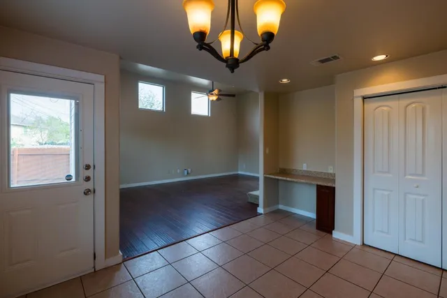 wooden floor in an empty room with a mirror