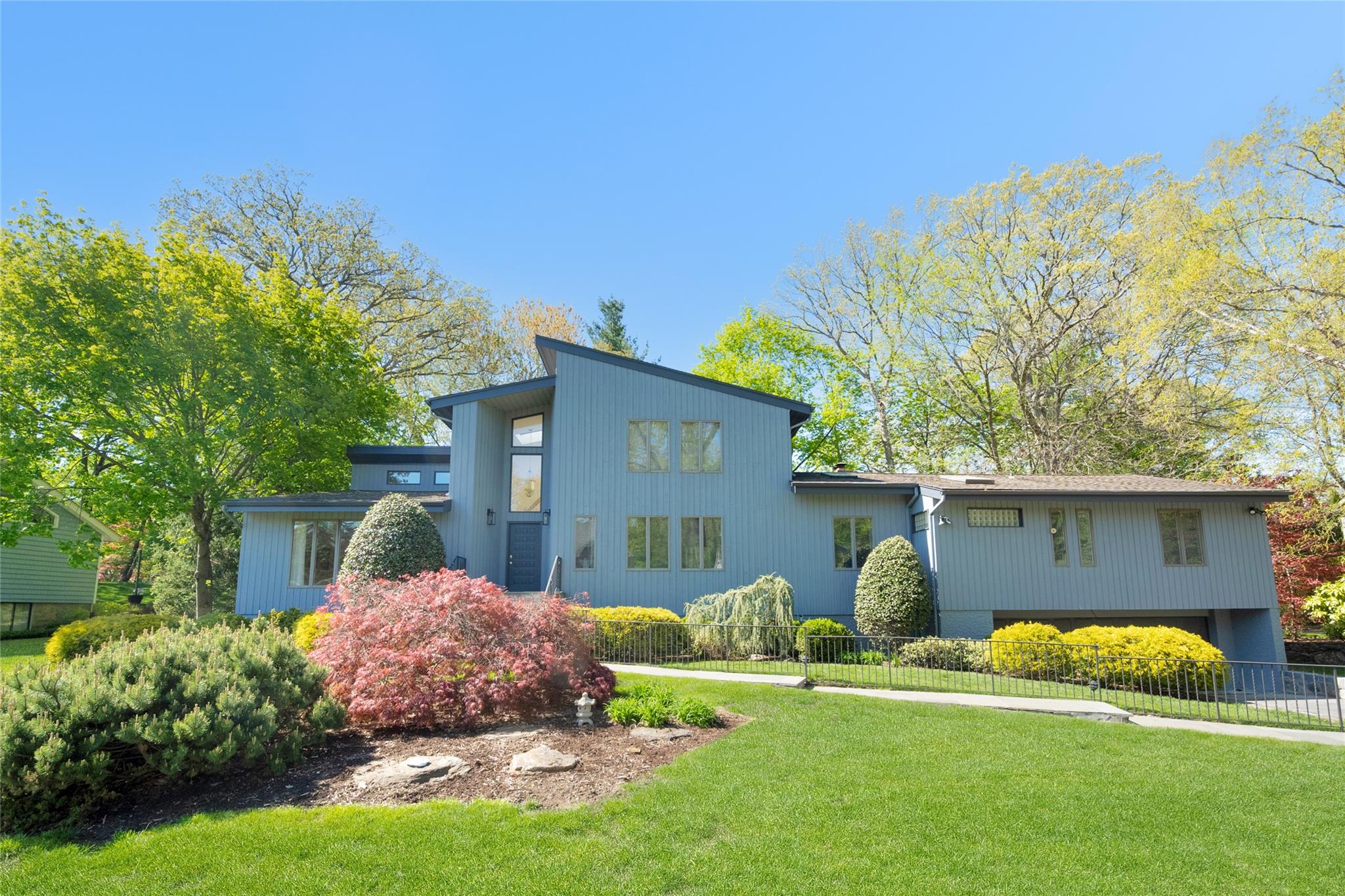 a front view of a house with garden
