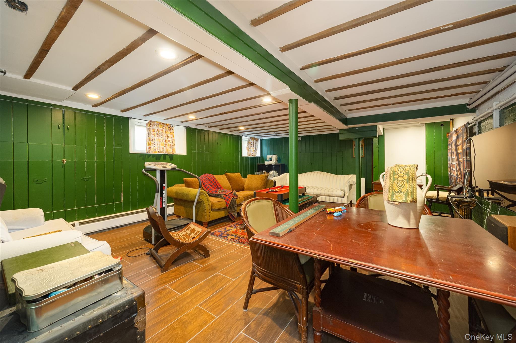 111 South Hamilton Street Poughkeepsie, NY 12601 - Photo 28 of 33 Spacious finished area featuring wood-finish flooring, exposed ceiling beams, recessed lighting, painted paneling, and a structural column