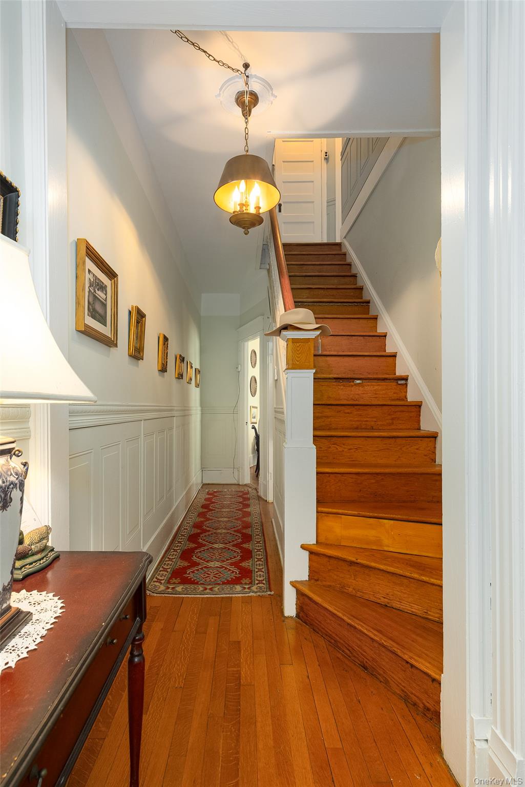 111 South Hamilton Street Poughkeepsie, NY 12601 - Photo 4 of 33 Entryway featuring wood-finish flooring that leads to one of two staircases