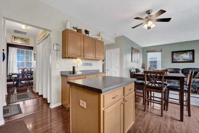 a kitchen with a cabinets and chairs