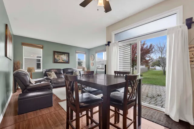 a view of a dining room with furniture window and outside view