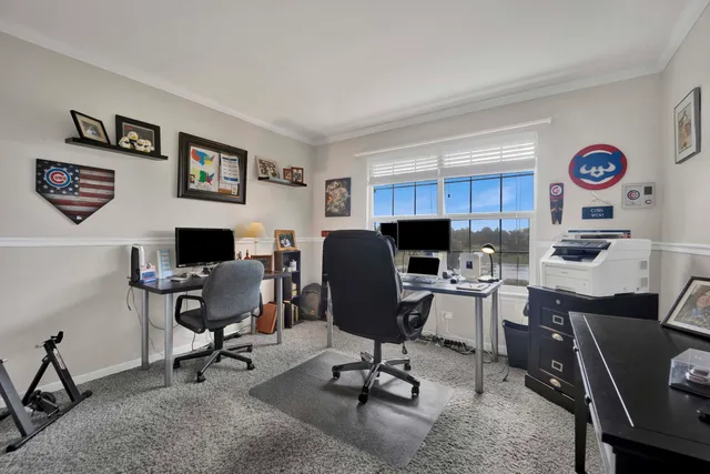 a view of a workspace with furniture and a workspace