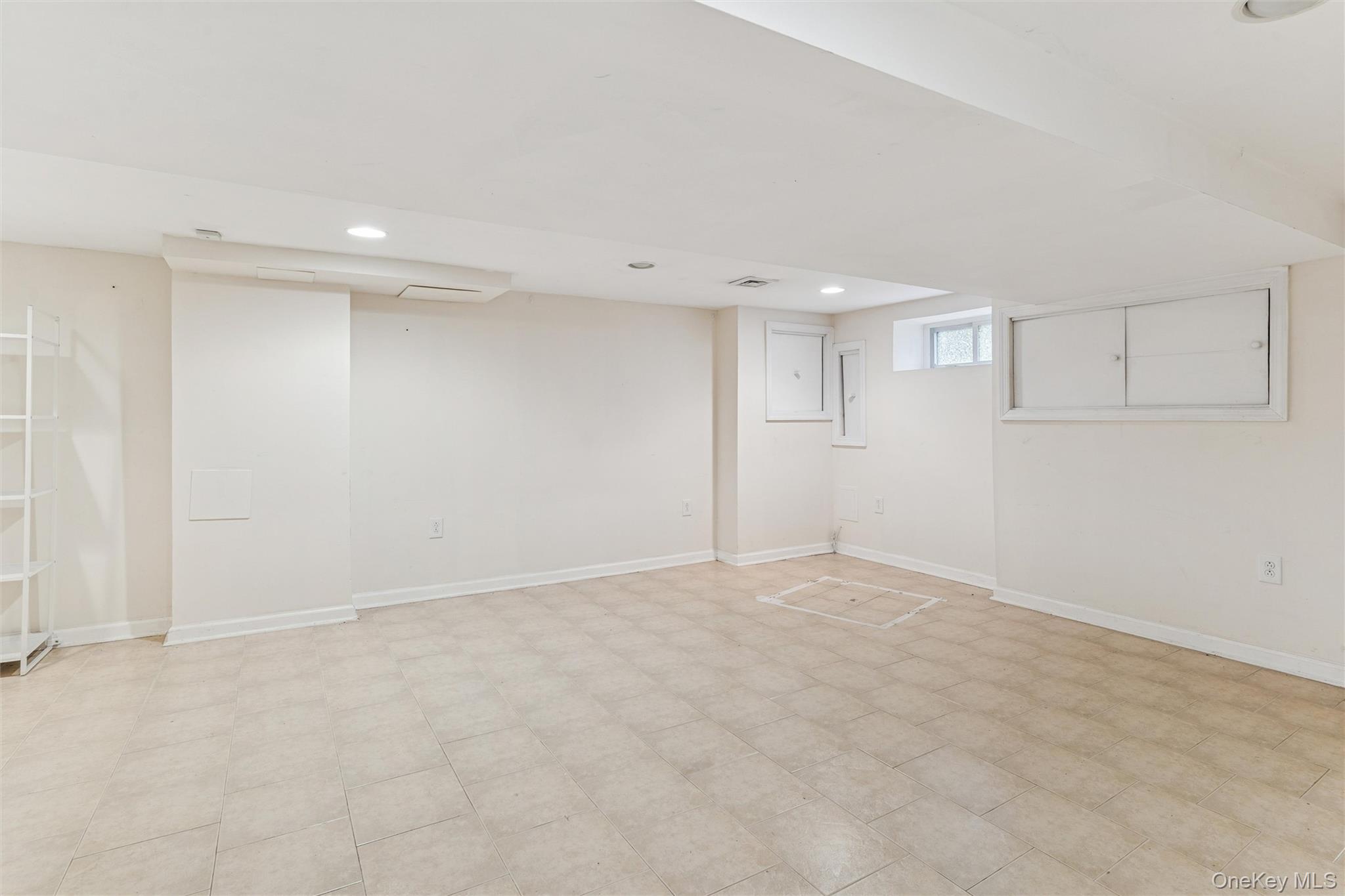 91-25 90th Street Queens, NY 11421 - Photo 22 of 30 Below grade area with recessed lighting