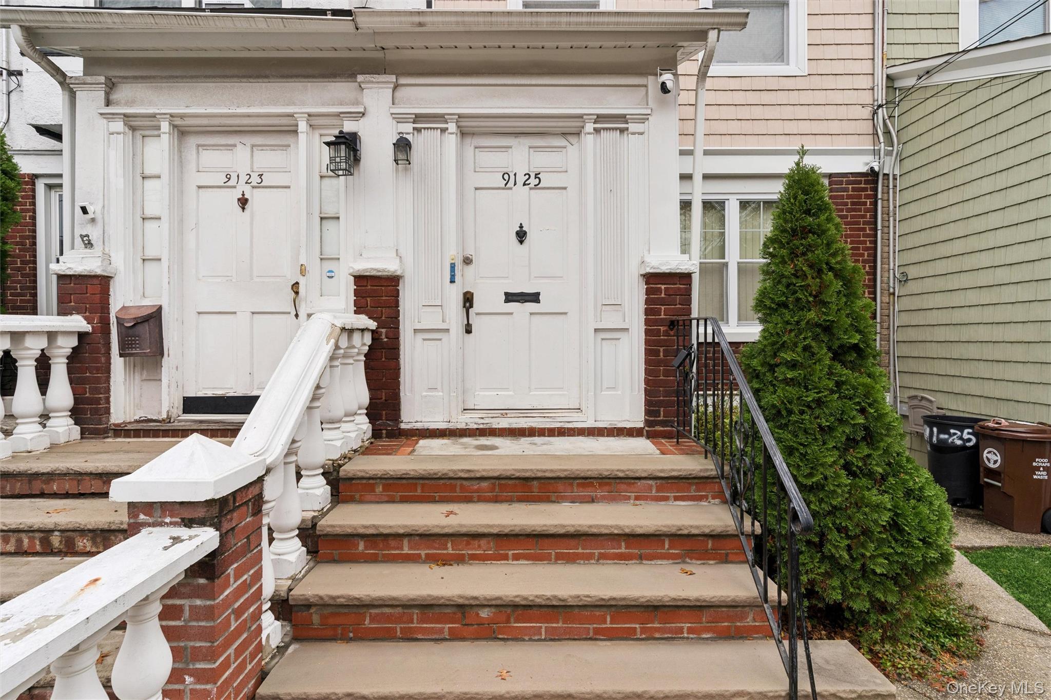 91-25 90th Street Queens, NY 11421 - Photo 26 of 30 Doorway to property with brick siding