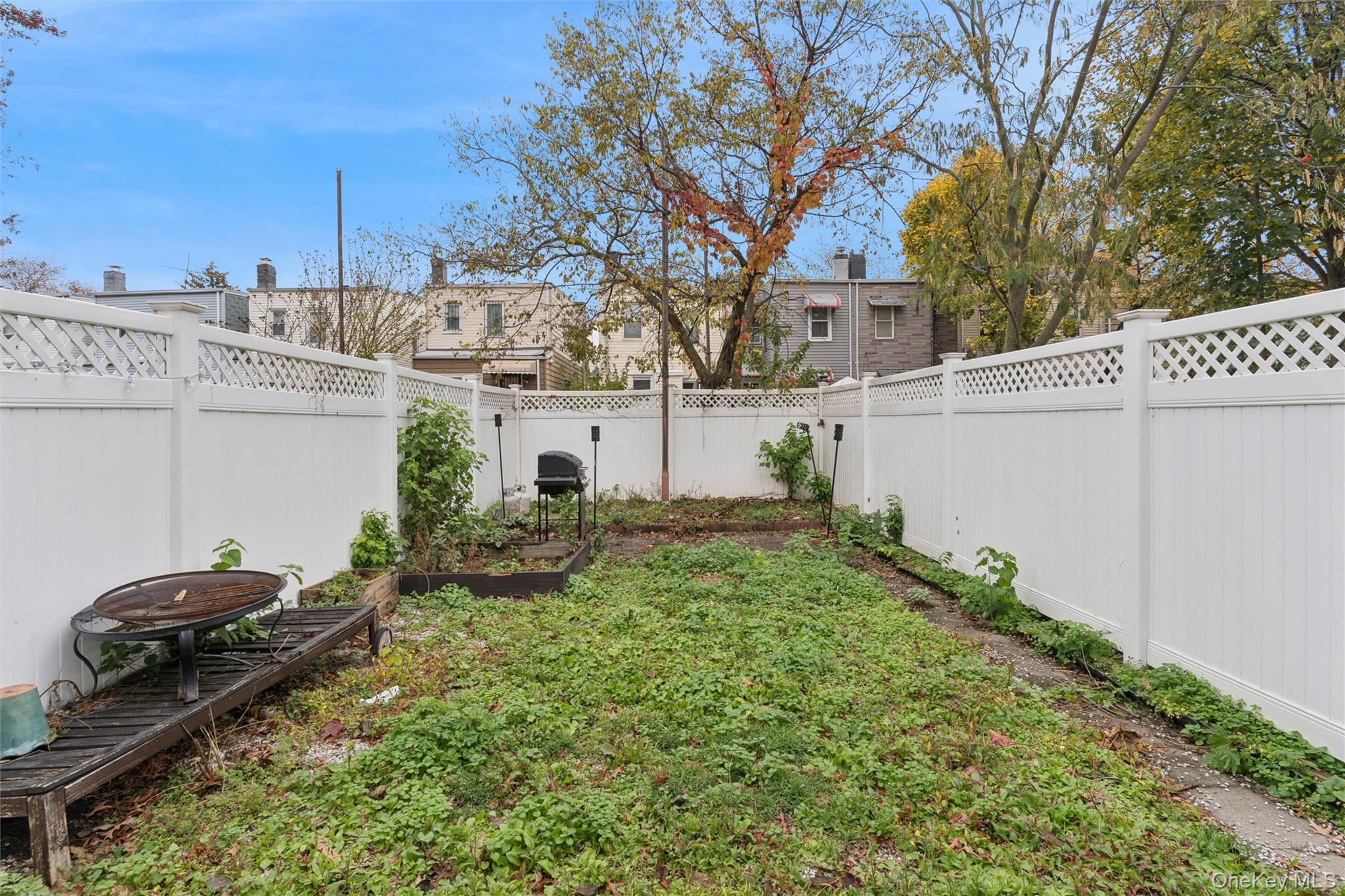 91-25 90th Street Queens, NY 11421 - Photo 30 of 30 Fenced backyard featuring a garden