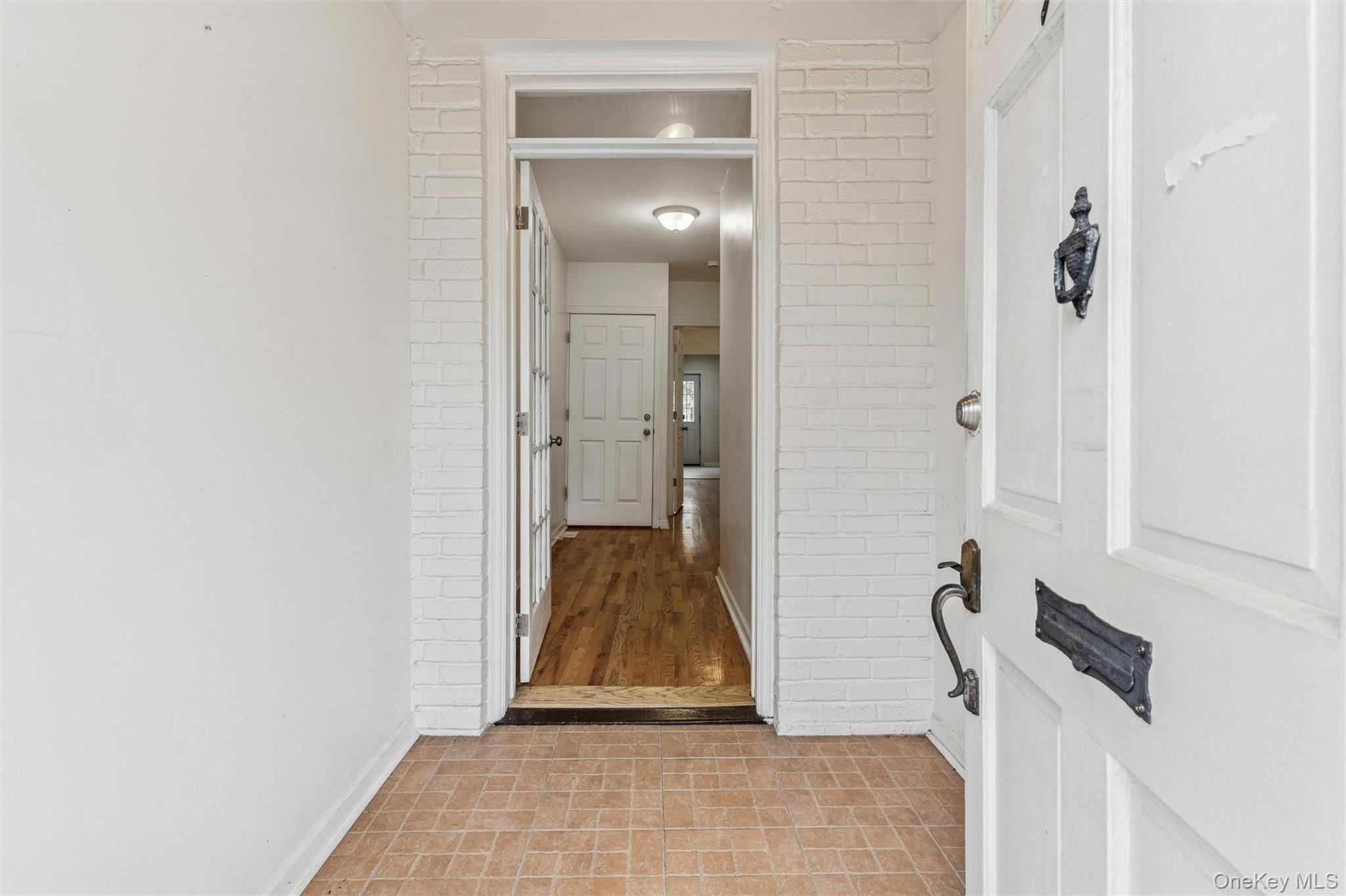 91-25 90th Street Queens, NY 11421 - Photo 3 of 30 Hall featuring baseboards and brick patterned flooring