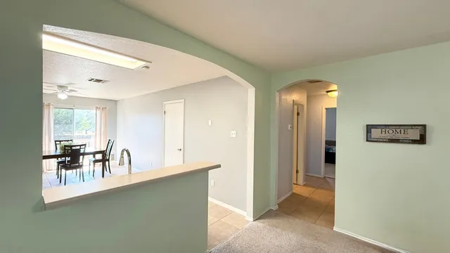a view of dining room with furniture and chandelier