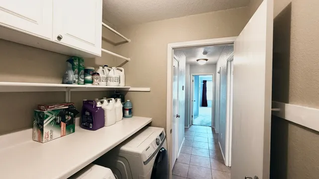 a kitchen with a table and chairs