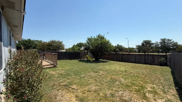 a backyard of a house with lots of green space