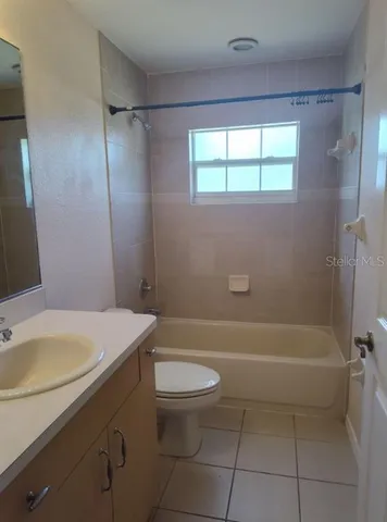 a living room with a couch and a table