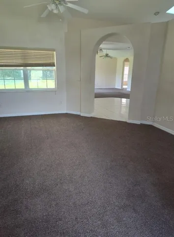 a large kitchen with granite countertop a stove a sink dishwasher and a refrigerator