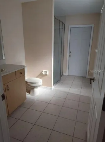 a spacious bathroom with a bathtub and a shower