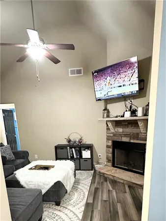 a bedroom with a bed and a fireplace