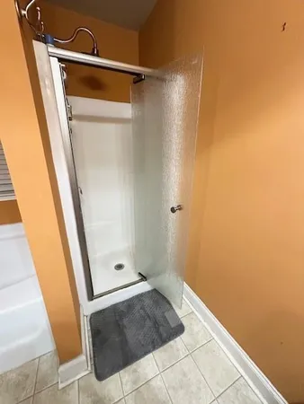 a bathroom with a sink vanity granite and a mirror