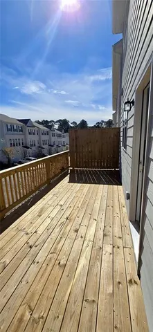 a view of balcony with wooden floor and city view