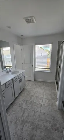 a view of a kitchen with dishwasher and white cabinets