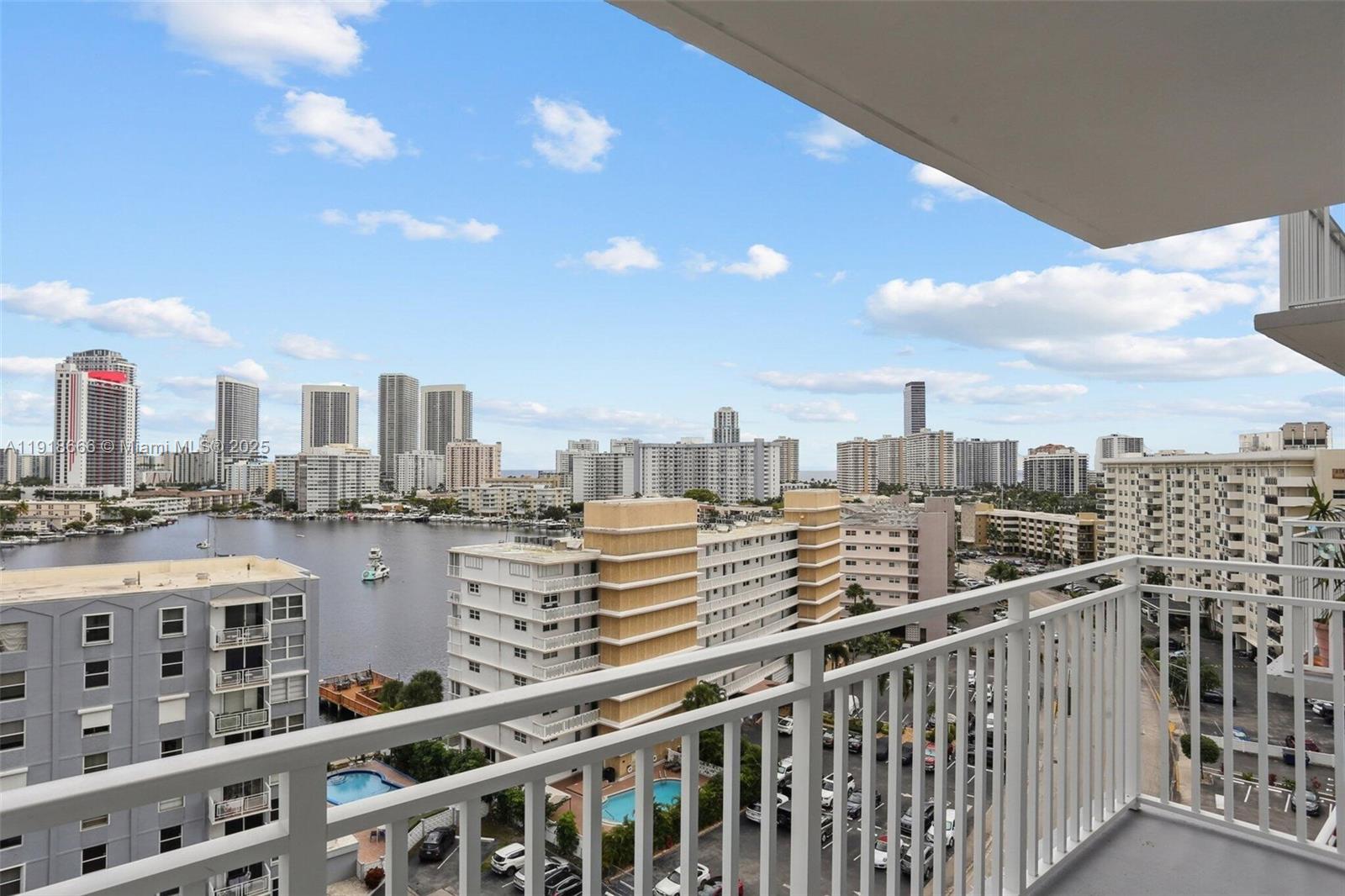 427 Golden Isles Drive, Unit 11F Hallandale Beach, FL 33009 - Photo 2 of 24 a view of city with a tall building
