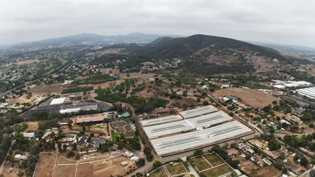 an aerial view of residential house with parking space