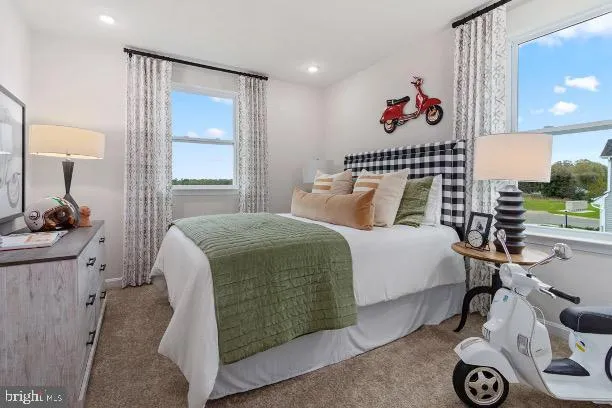 a bedroom with a bed and a table in it