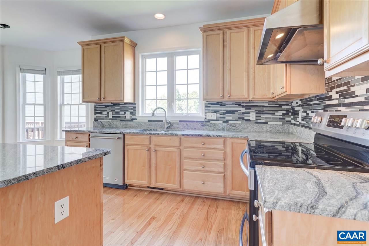 1280 Amber Ridge Road Charlottesville, VA 22901 - Photo 11 of 33 a kitchen with stainless steel appliances granite countertop a stove a sink and a microwave