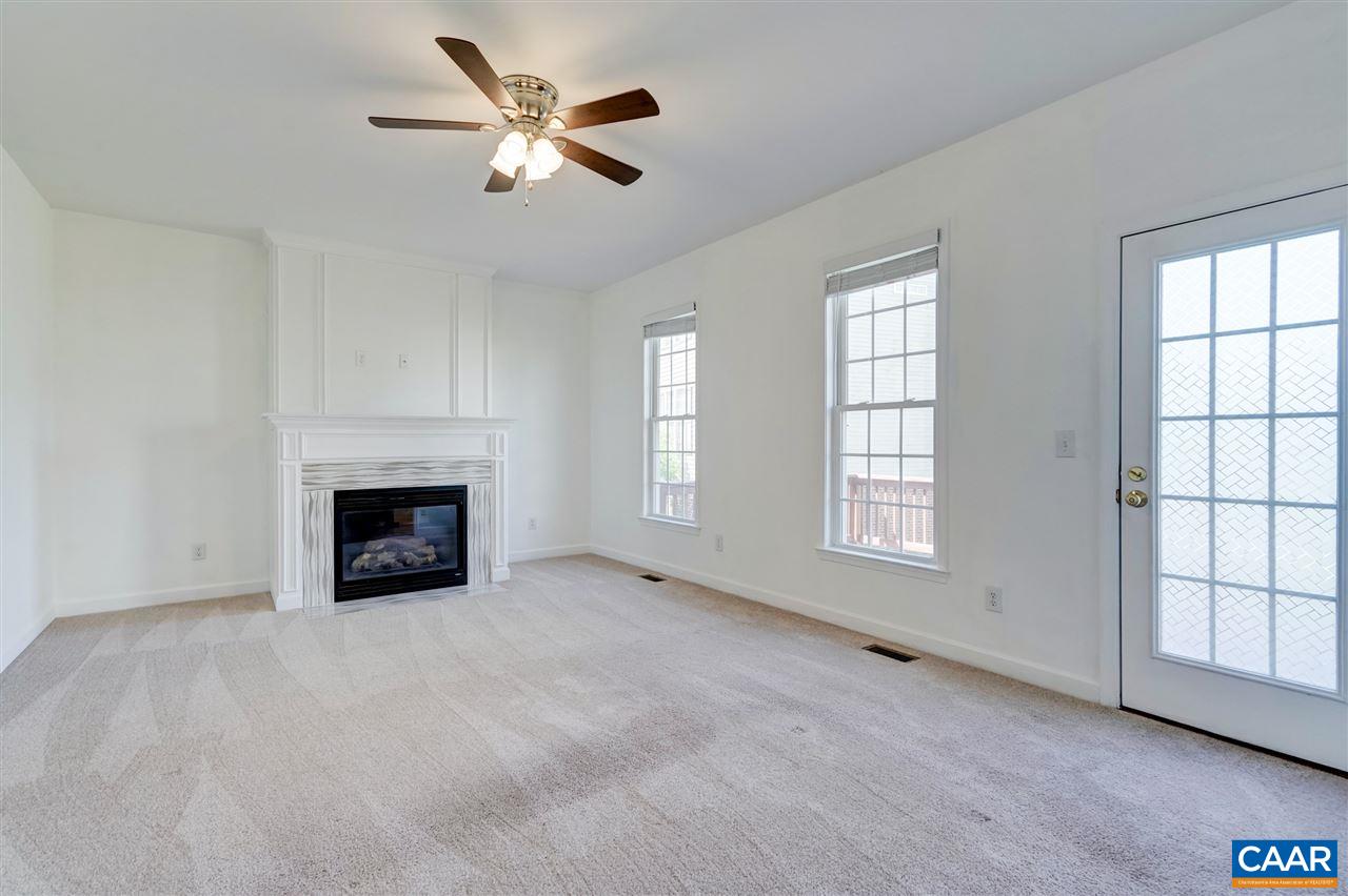 1280 Amber Ridge Road Charlottesville, VA 22901 - Photo 16 of 33 an empty room with windows and fireplace