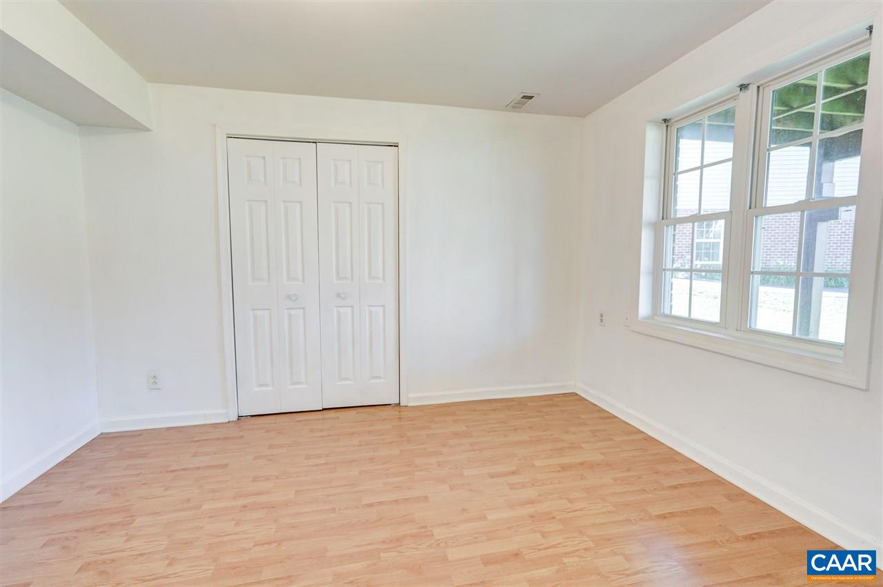1280 Amber Ridge Road Charlottesville, VA 22901 - Photo 31 of 33 a view of an empty room with a window