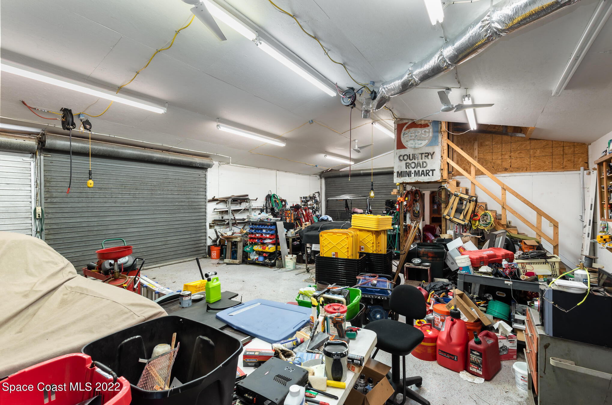 4275 Rayburn Road Cocoa, FL 32926 - Photo 22 of 26 a view of a room with gym equipment