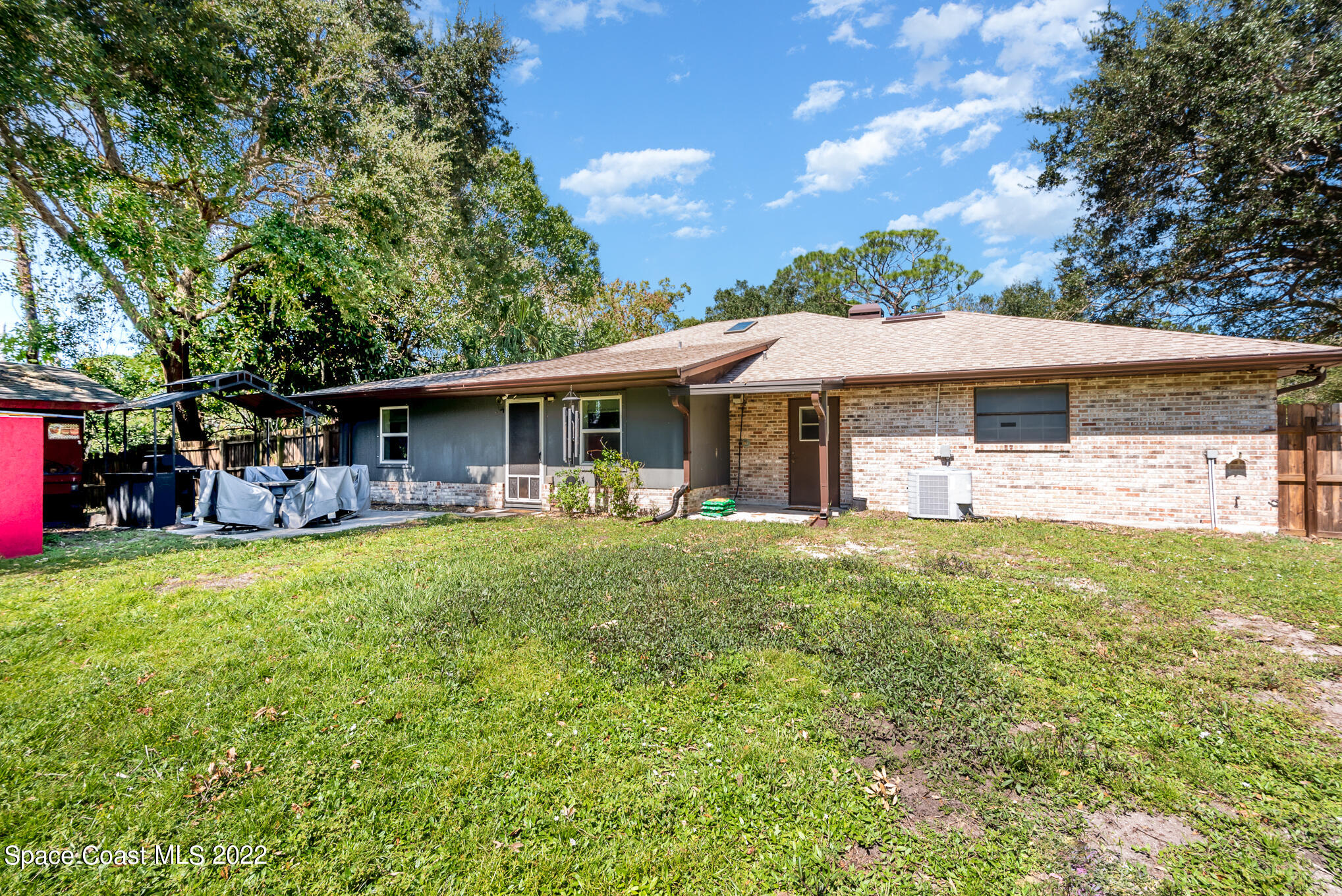 4275 Rayburn Road Cocoa, FL 32926 - Photo 23 of 26 a view of a house with a backyard patio and swimming pool
