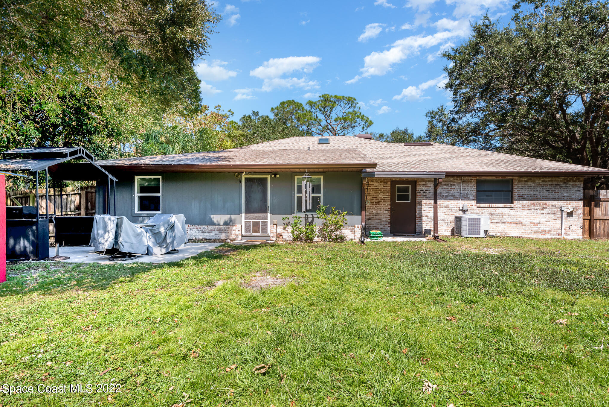 4275 Rayburn Road Cocoa, FL 32926 - Photo 24 of 26 a front view of a house with a yard porch and furniture