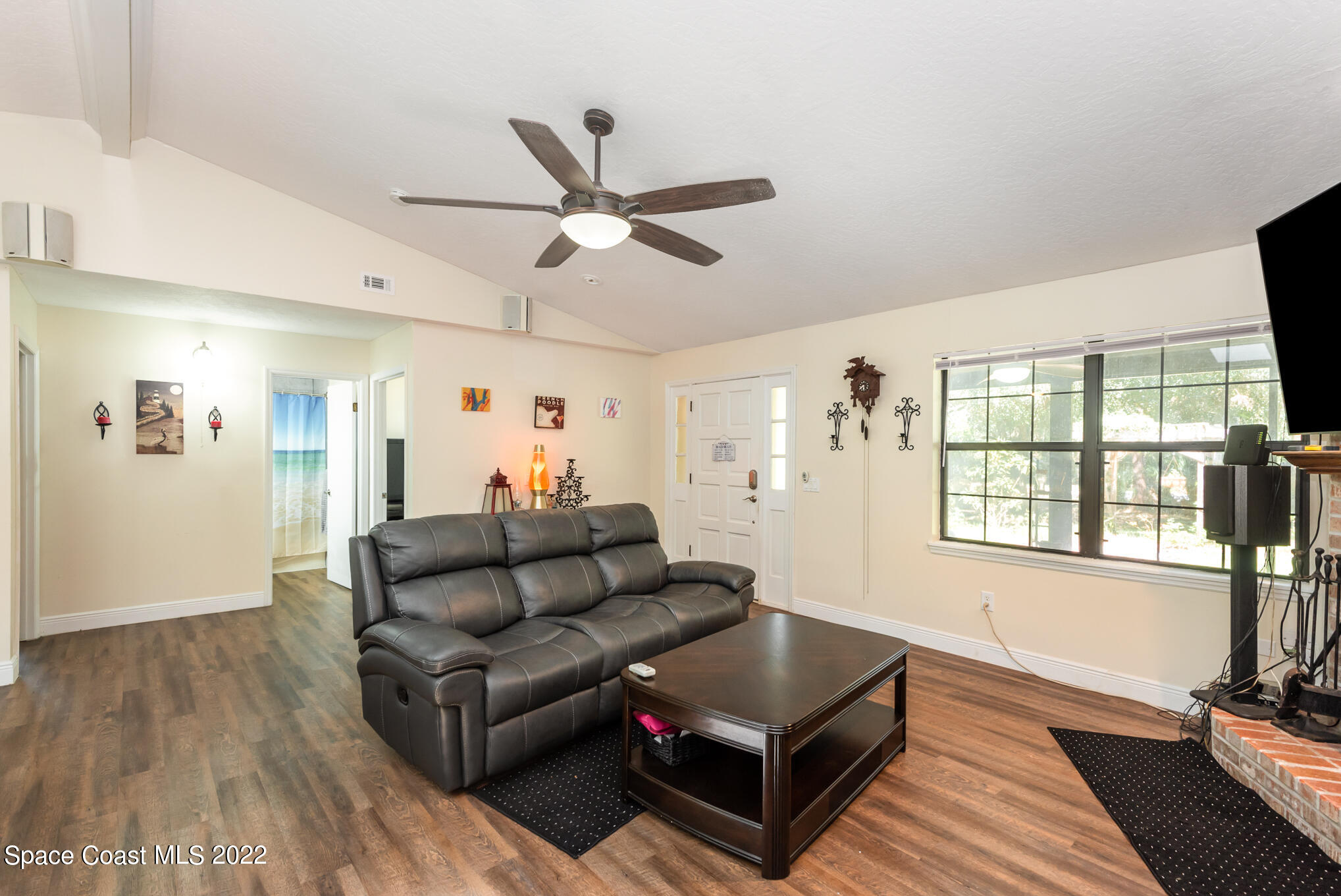 4275 Rayburn Road Cocoa, FL 32926 - Photo 7 of 26 a living room with furniture and a large window