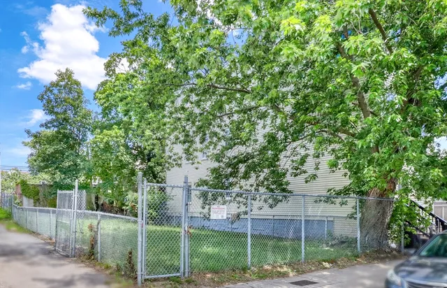 a view of a building with a tree in front of it