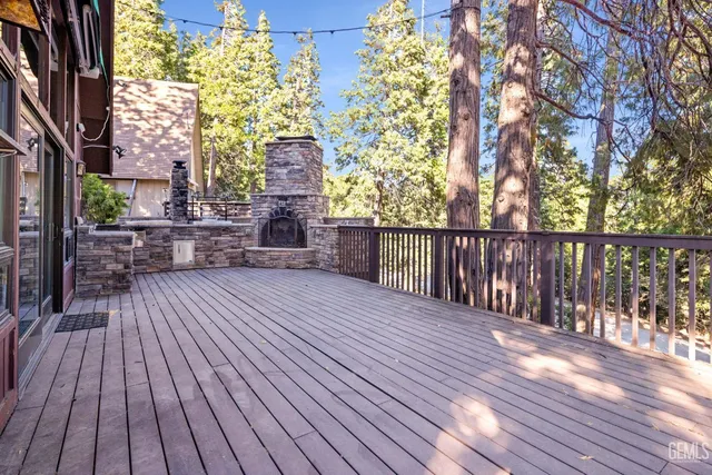 a patio with wooden floor and fence