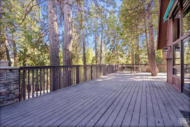 a view of deck with wooden floor and outdoor seating