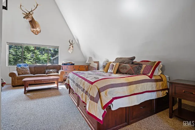 a bedroom with bed and a couch