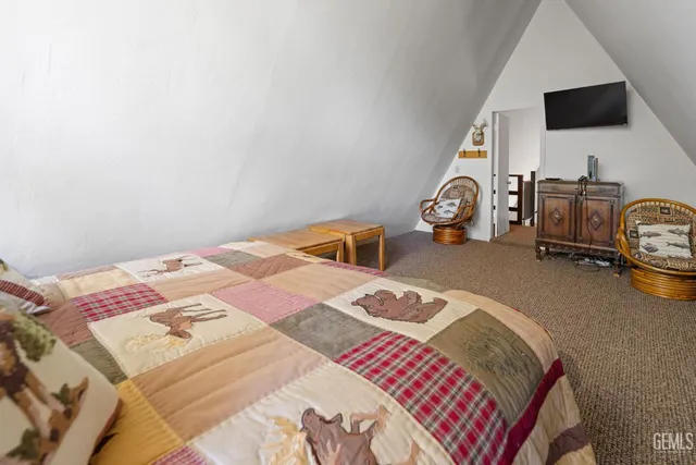 a view of a kitchen with a sink and dishwasher a refrigerator with wooden floor