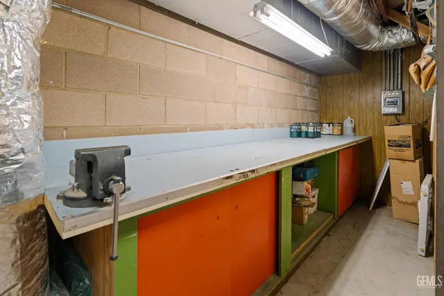 a view of a hallway with wooden floor and a kitchen