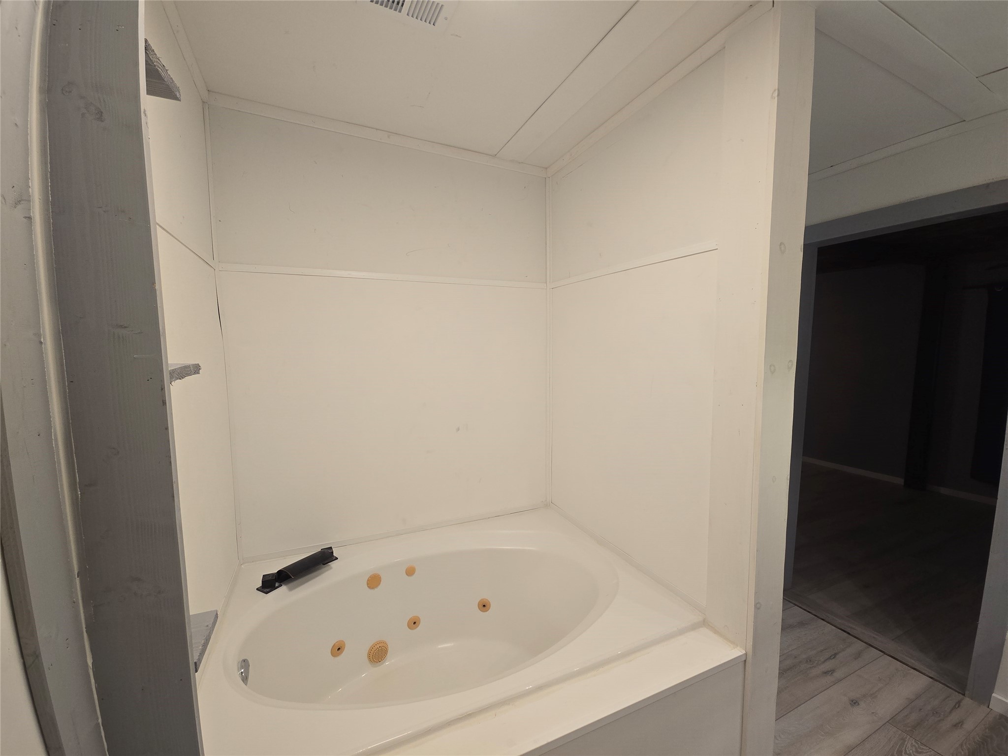 1045 Vine Drive Angleton, TX 77515 - Photo 15 of 48 a white bath tub sitting in a bathroom