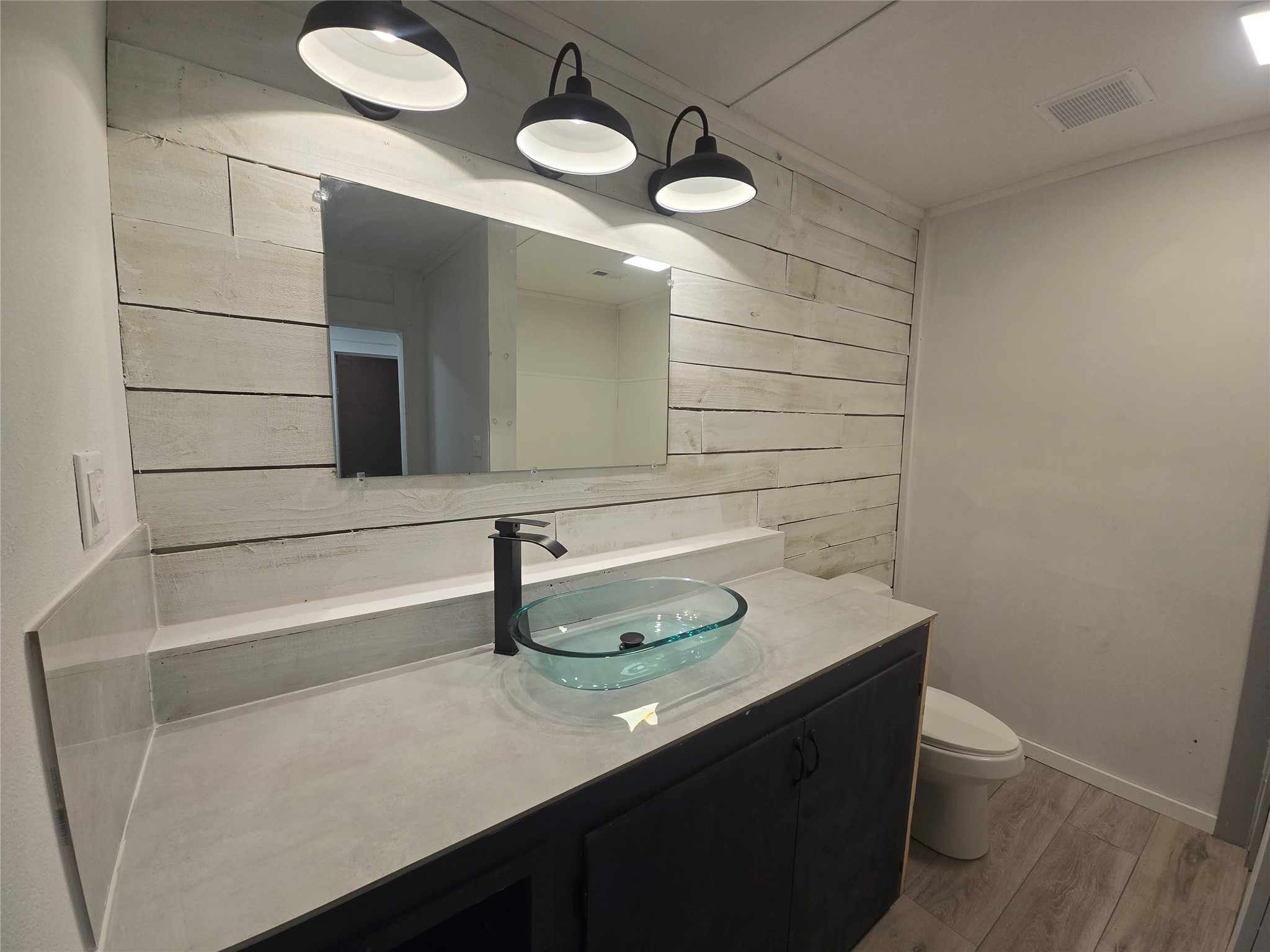1045 Vine Drive Angleton, TX 77515 - Photo 16 of 48 a bathroom with a sink and a mirror