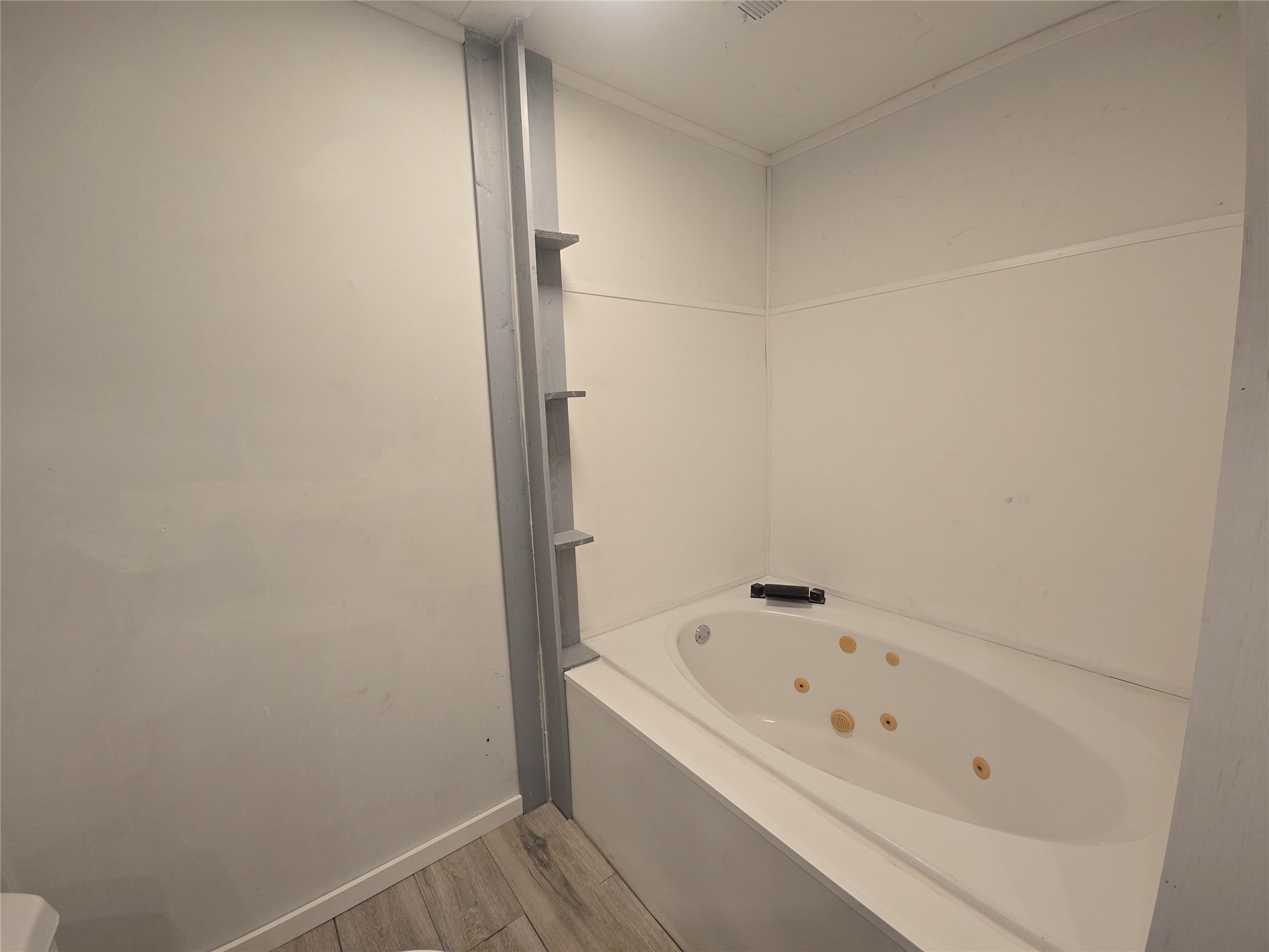1045 Vine Drive Angleton, TX 77515 - Photo 17 of 48 a bathroom with a bathtub
