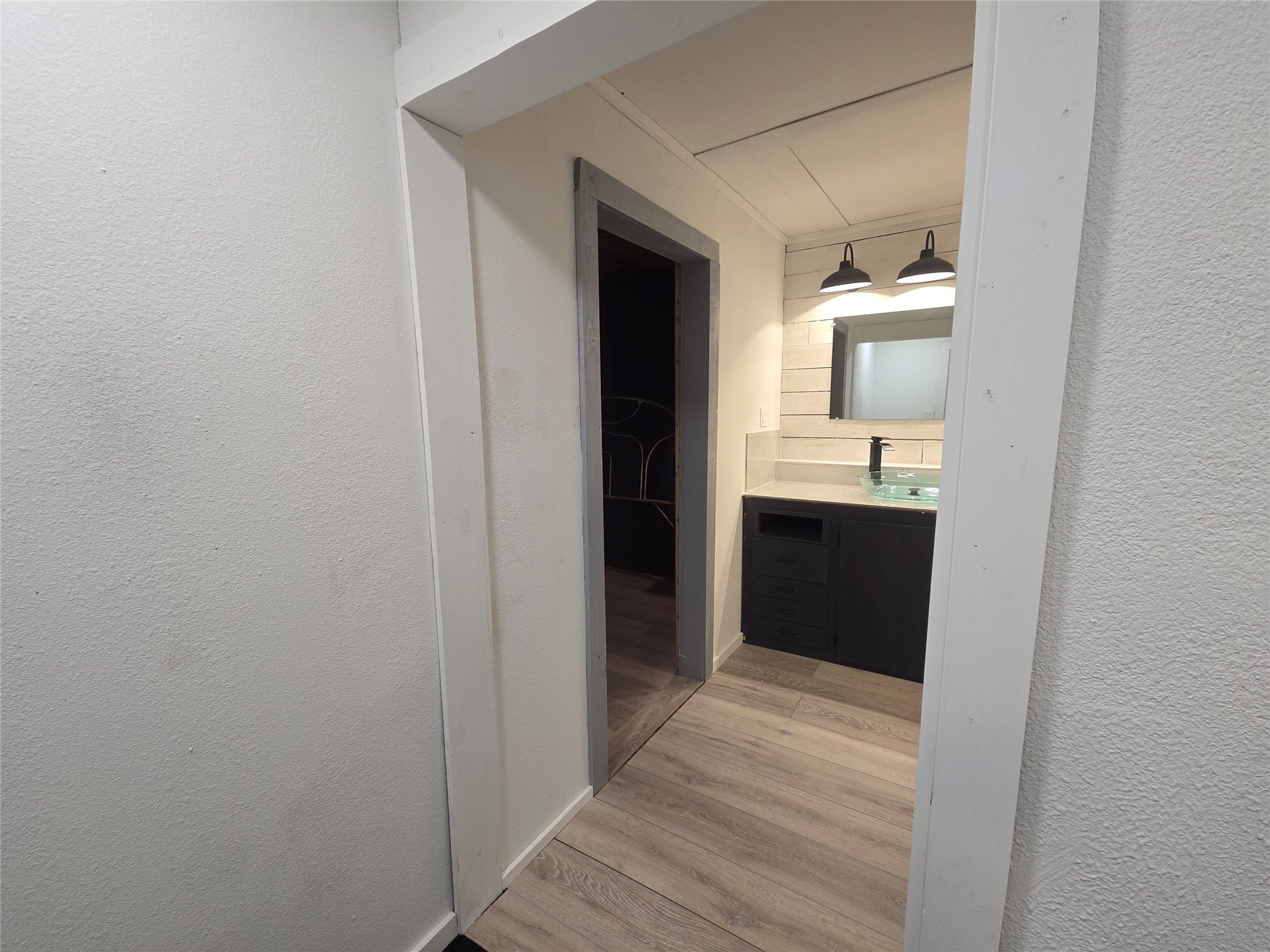 1045 Vine Drive Angleton, TX 77515 - Photo 19 of 48 a bathroom with a sink and a mirror