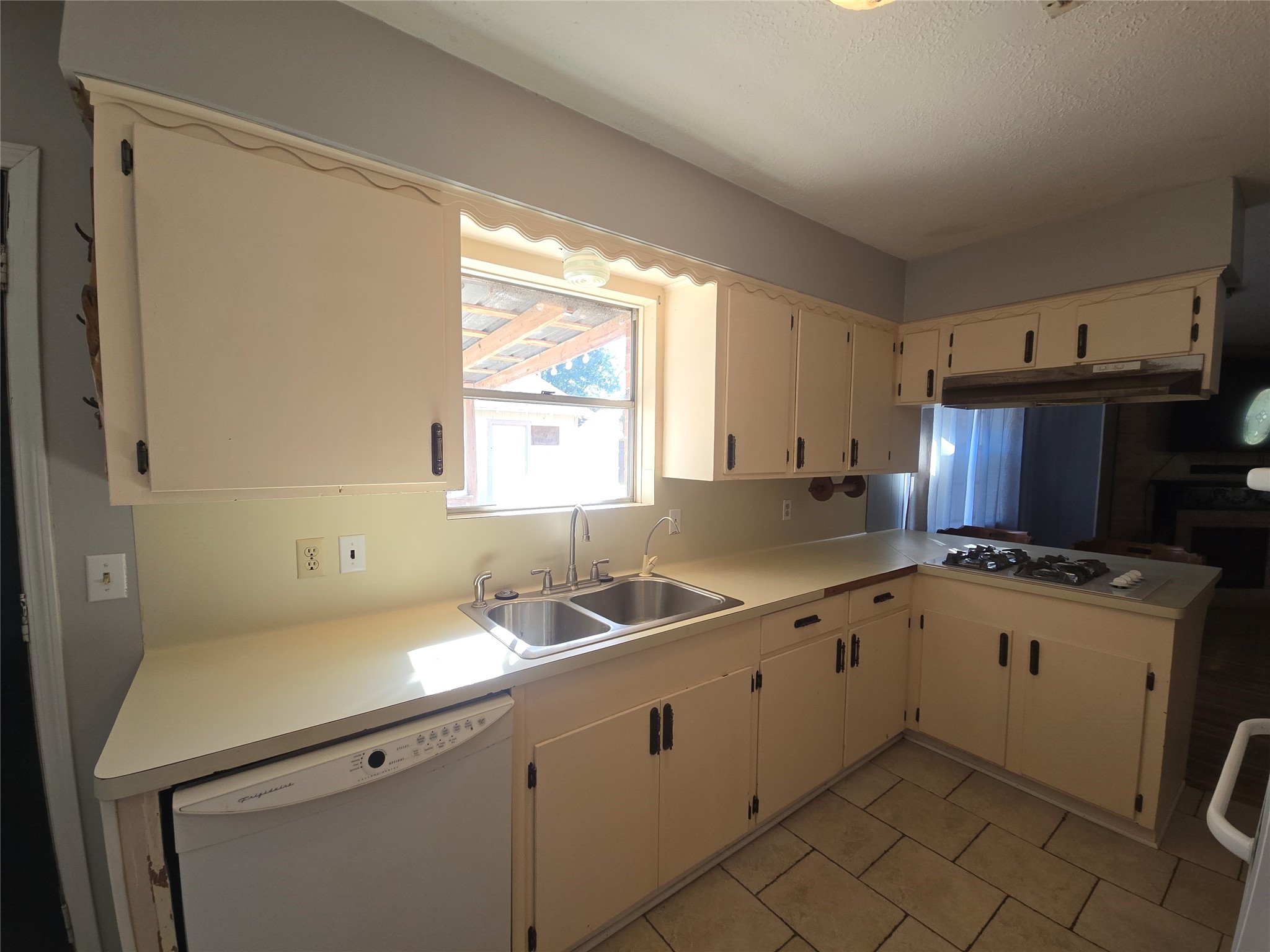 1045 Vine Drive Angleton, TX 77515 - Photo 21 of 48 a kitchen with sink cabinets and window