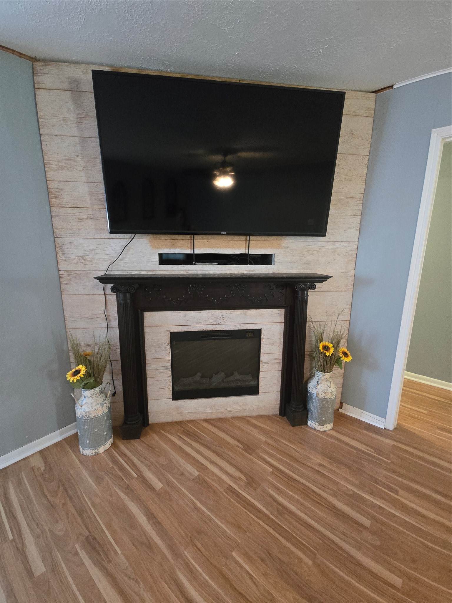 1045 Vine Drive Angleton, TX 77515 - Photo 28 of 48 a living room with a fireplace and a table
