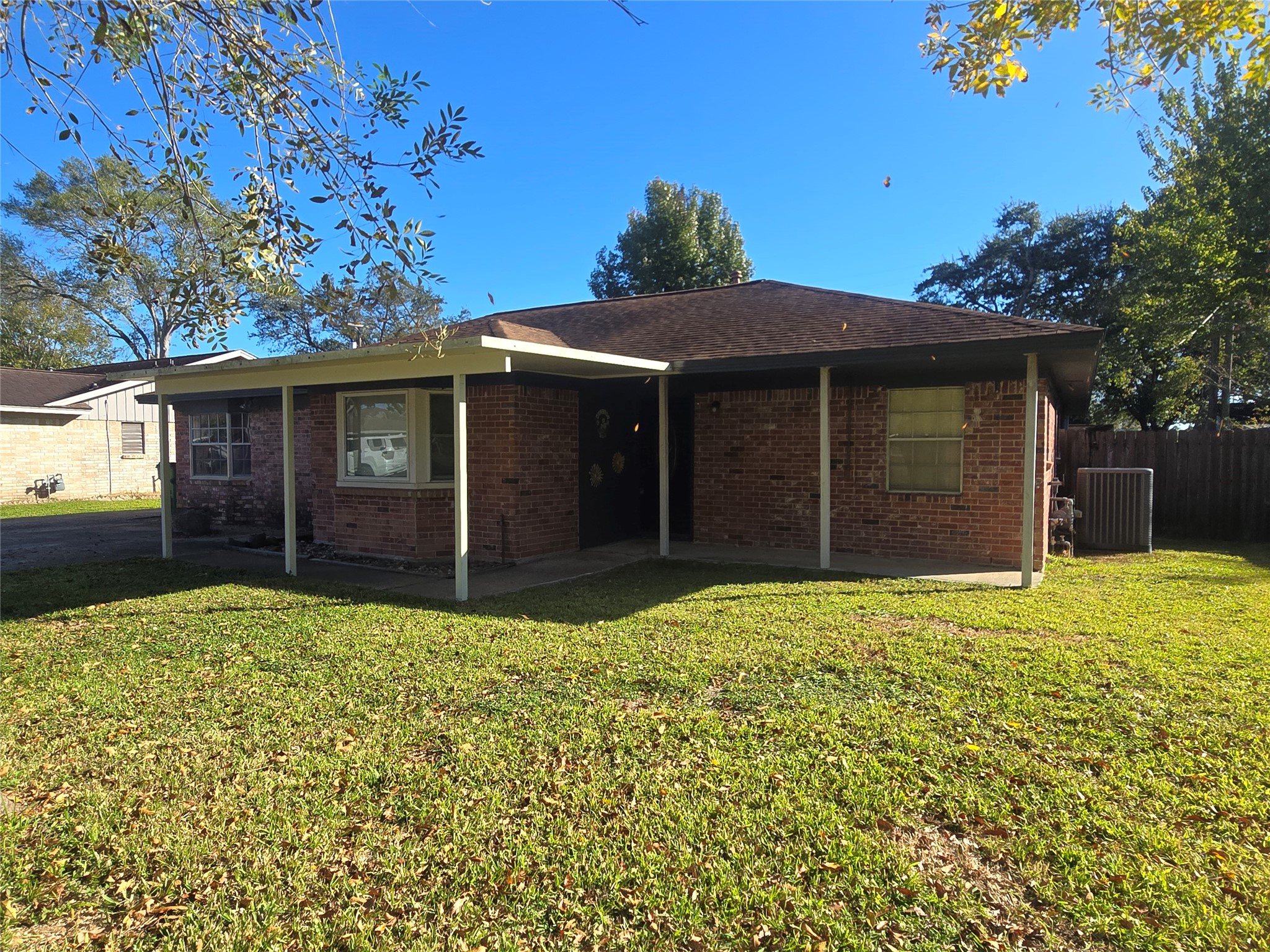 1045 Vine Drive Angleton, TX 77515 - Photo 3 of 48 a front view of a house with a yard