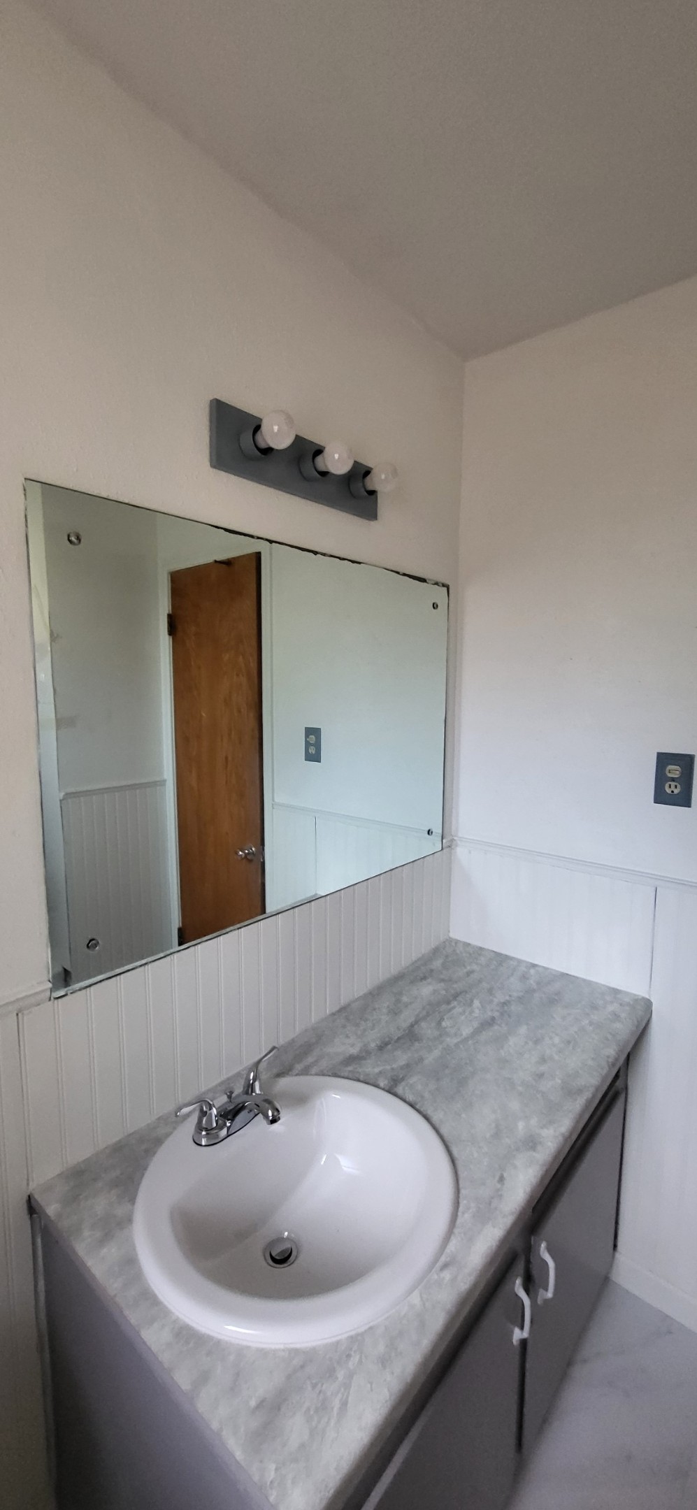 1045 Vine Drive Angleton, TX 77515 - Photo 37 of 48 a bathroom with a granite countertop sink and a mirror