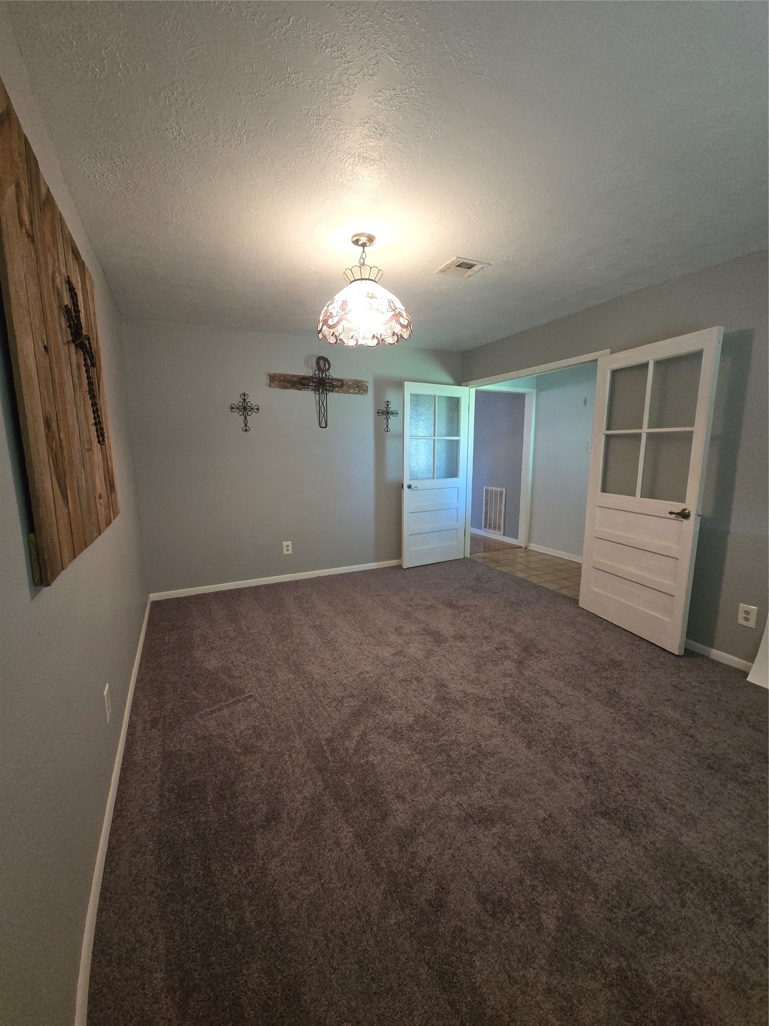 1045 Vine Drive Angleton, TX 77515 - Photo 40 of 48 an empty room with windows and fireplace