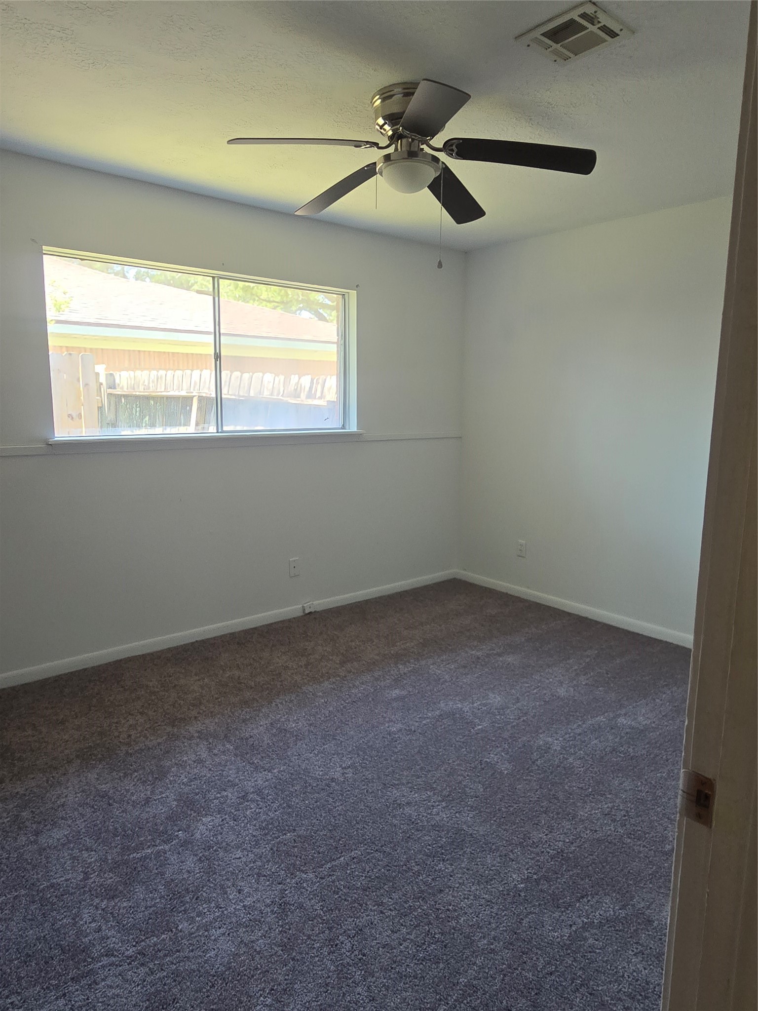 1045 Vine Drive Angleton, TX 77515 - Photo 44 of 48 a view of an empty room with a window