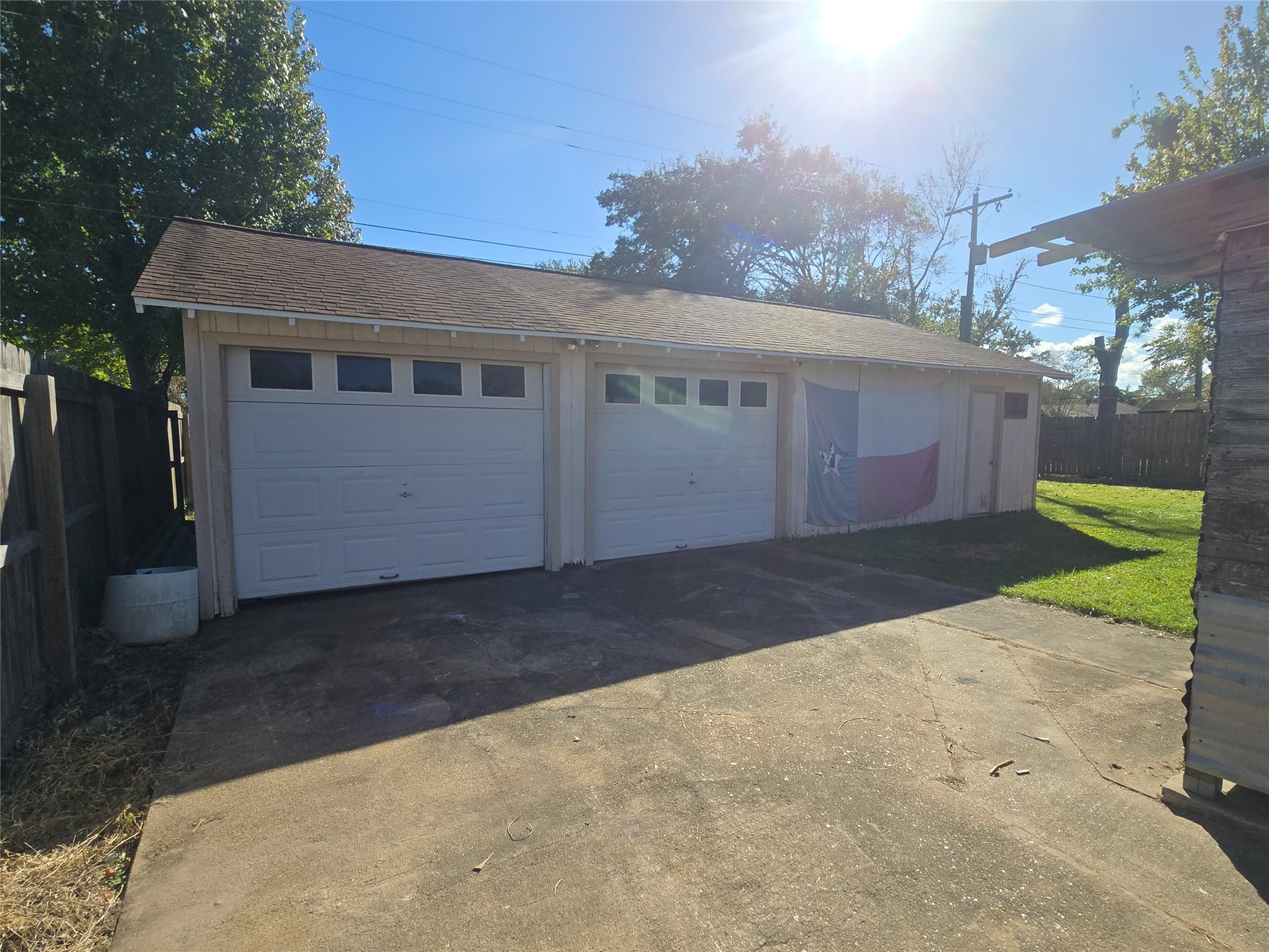 1045 Vine Drive Angleton, TX 77515 - Photo 5 of 42 a view of a house with a yard and garage