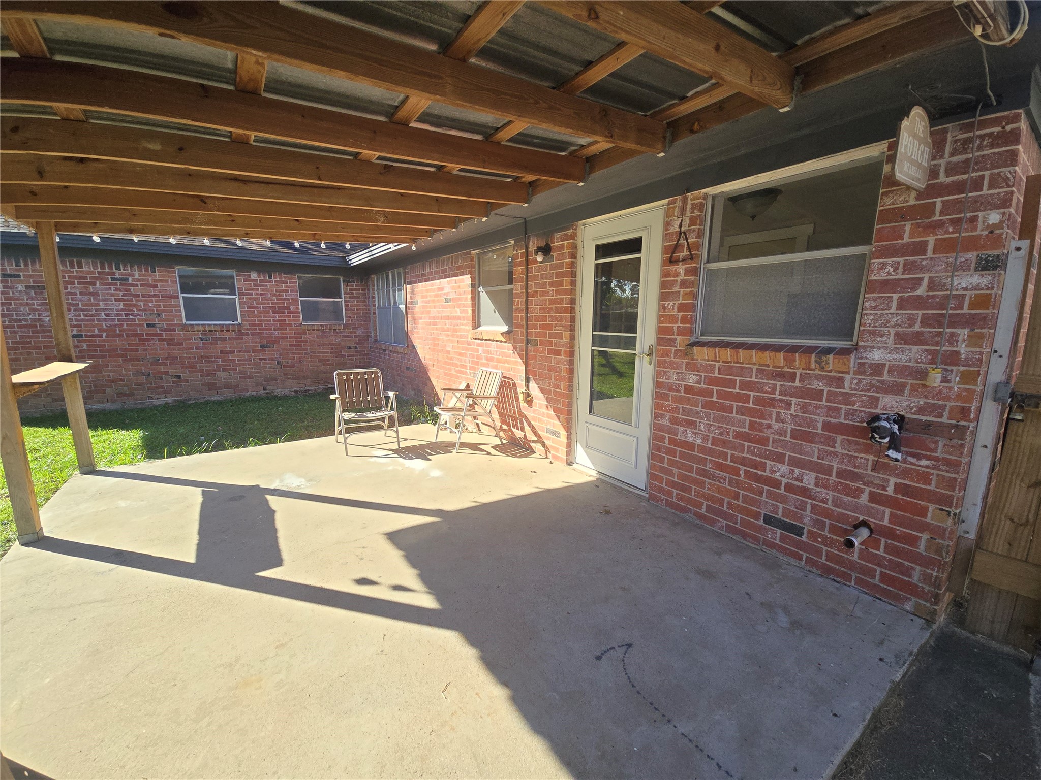 1045 Vine Drive Angleton, TX 77515 - Photo 6 of 48 a view of backyard with a table and chairs and potted plants